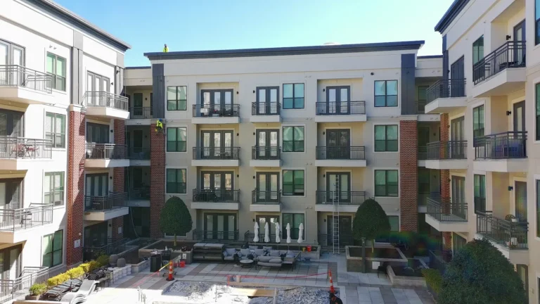 Four-story apartment building exterior and courtyard on an AVB Construction commercial project