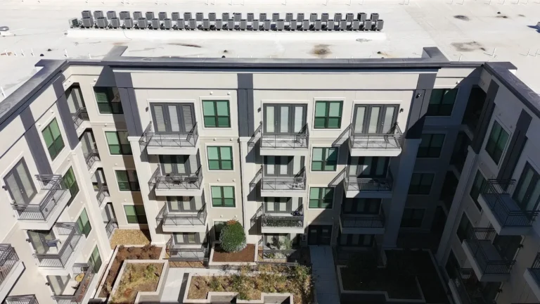 Multi-story apartment building exterior viewed from above