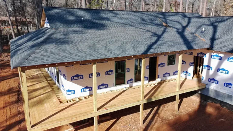 Pressure-treated porch deck and roof framing on a new AVB Construction home