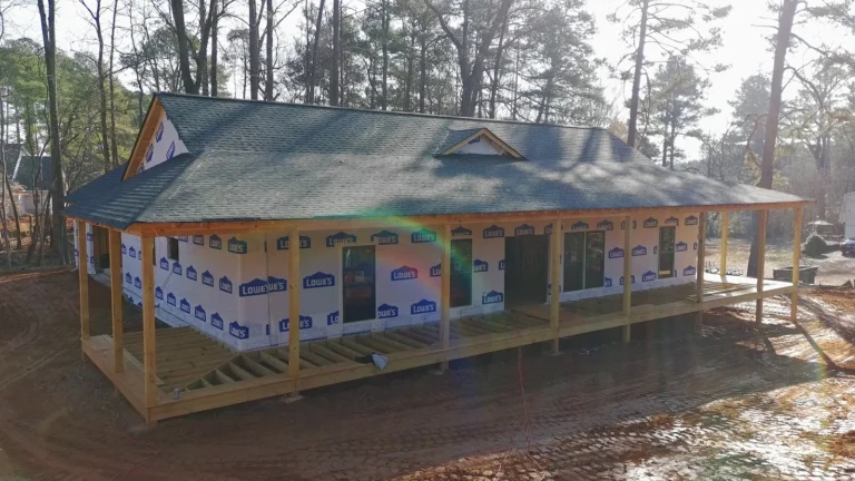 New single-family home build by AVB Construction with framed front porch and fresh shingle roof